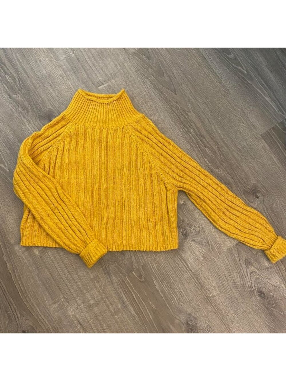 Yellow turtleneck sweater